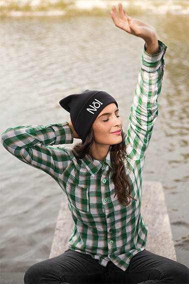 beanie-mockup-featuring-a-peaceful-woman-by-a-lake-24629